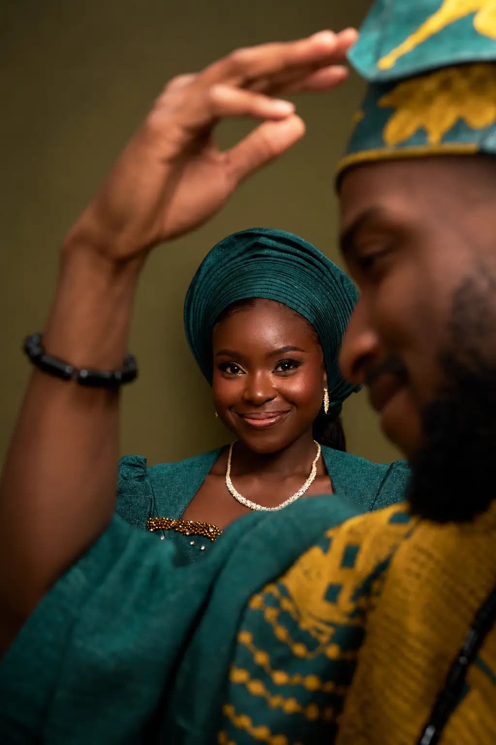 Bride lying back in a lace wedding gown